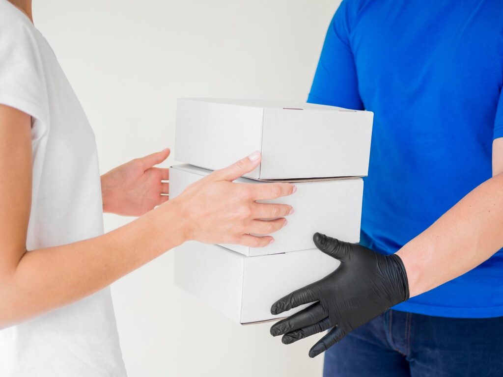 close-up-courier-delivering-boxes
