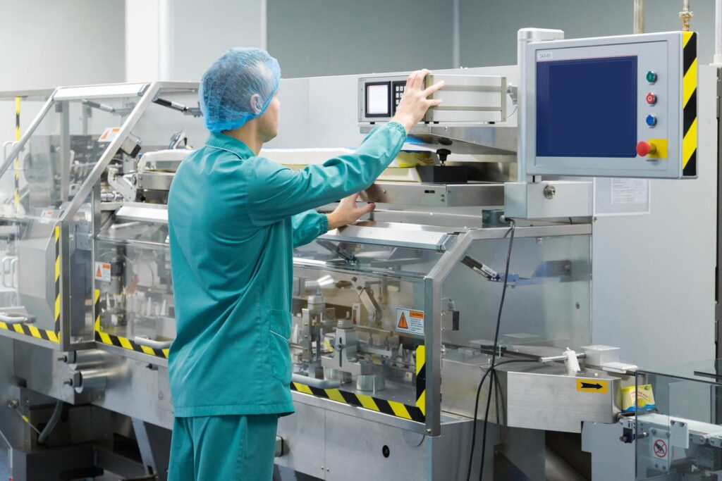 pharmaceutical-factory-man-worker-protective-clothing-operating-production-line-sterile-environment
